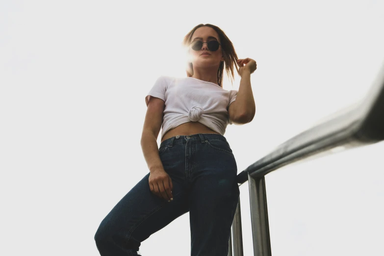 a woman leaning on steps with her hand on her head