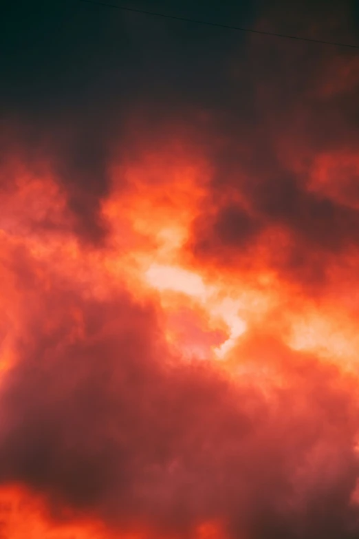 a plane flying by during a cloudy sunset