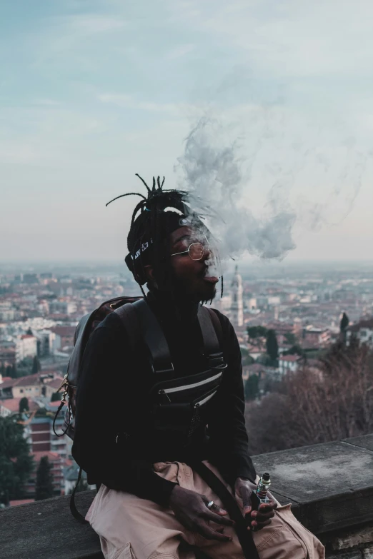 a person with a mohawk smokes a cigarette above a city