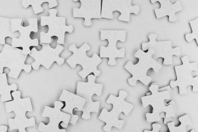 a black and white puzzle piece has been cut out