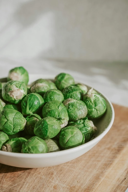 a bowl with brussel sprouts in it