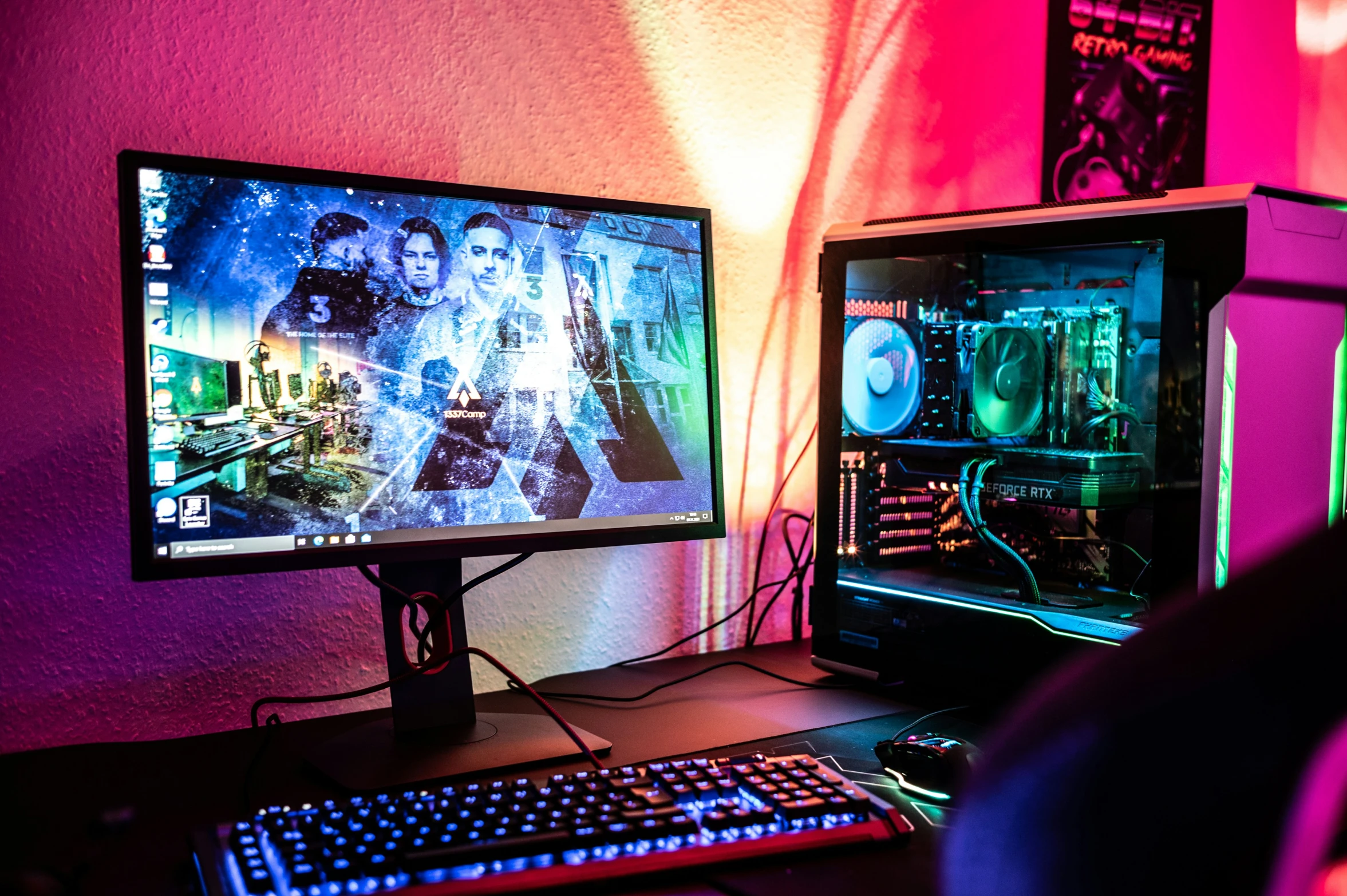 a person sitting at a desk looking at a computer