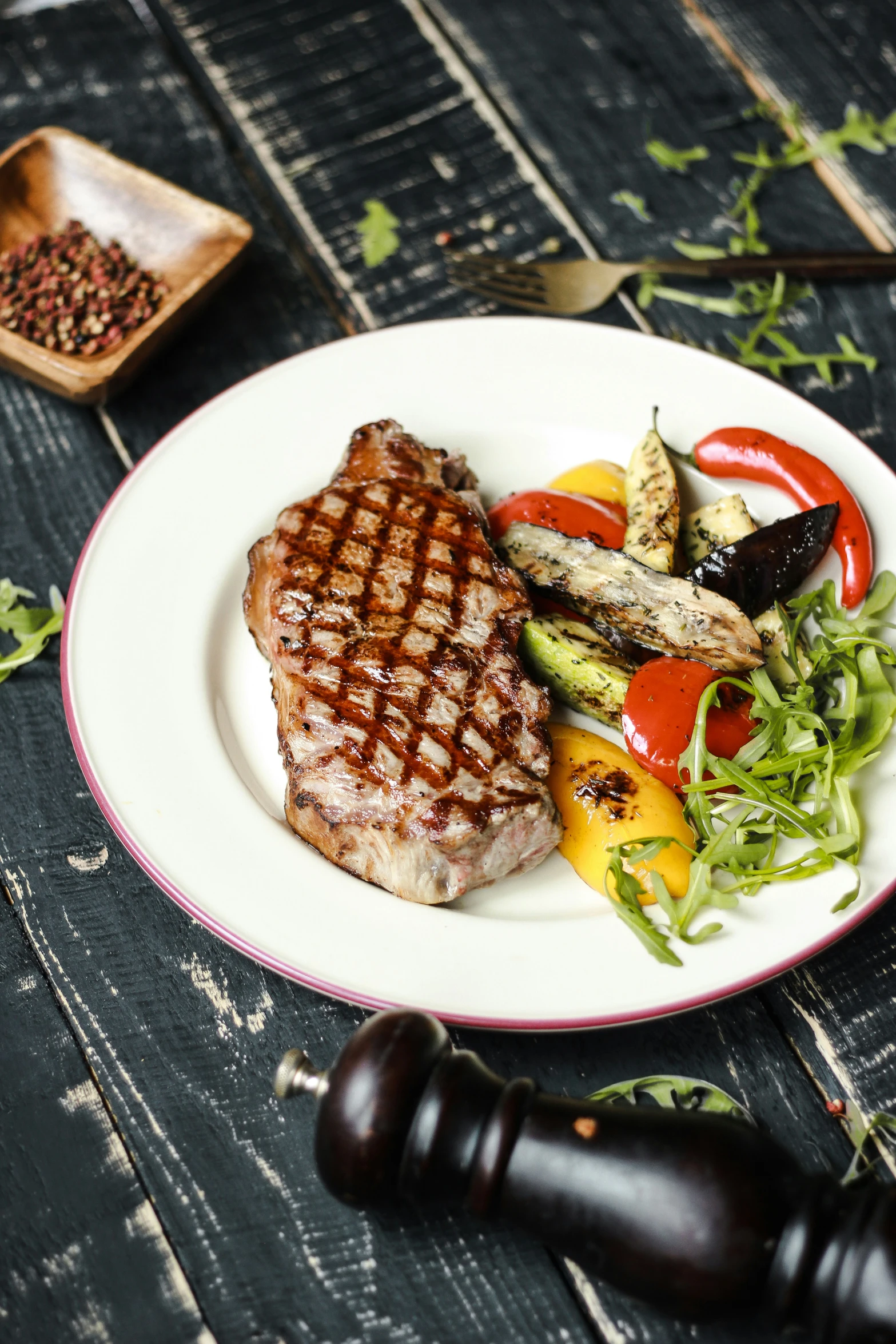 a plate with some meat on it and vegetables