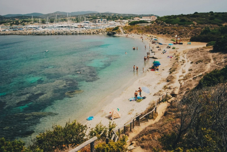 an aerial view of people playing on the beach