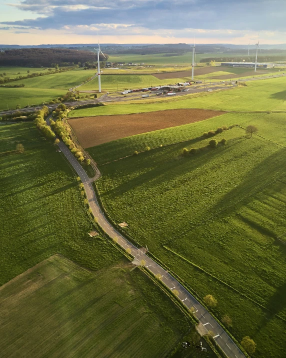 aerial view of wind turbines and farmland