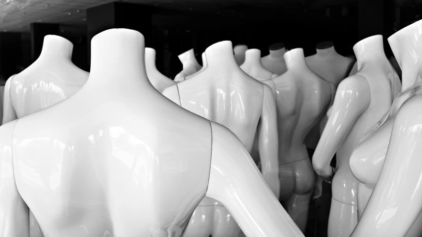 black and white pograph of  mannequins lined up