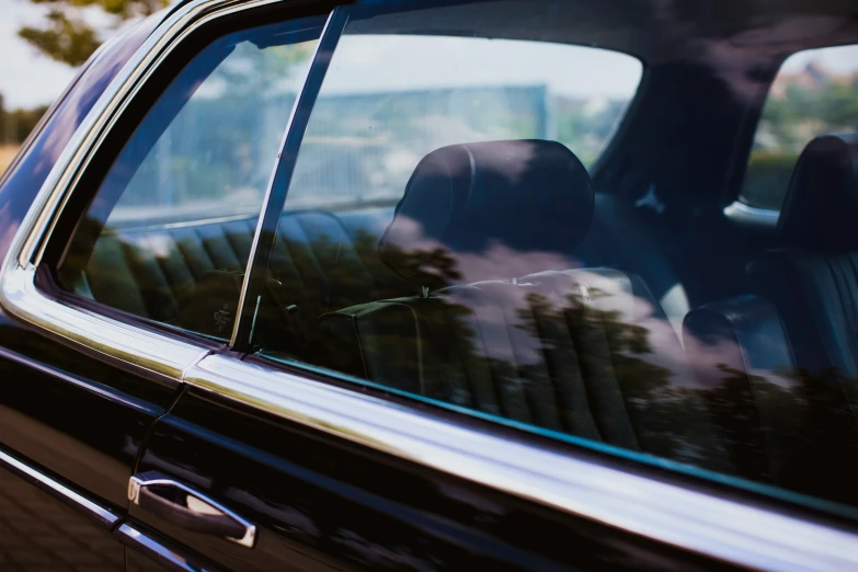 a window in a black vehicle with black leather trim