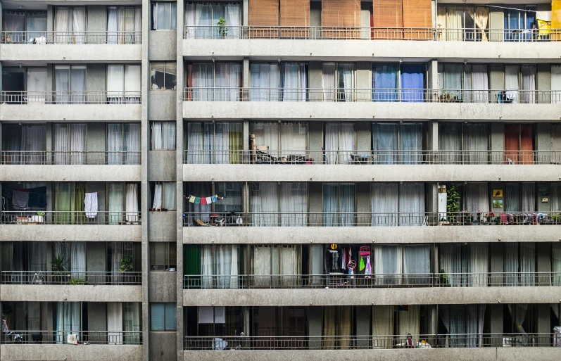 several balconies are seen in this urban apartment building