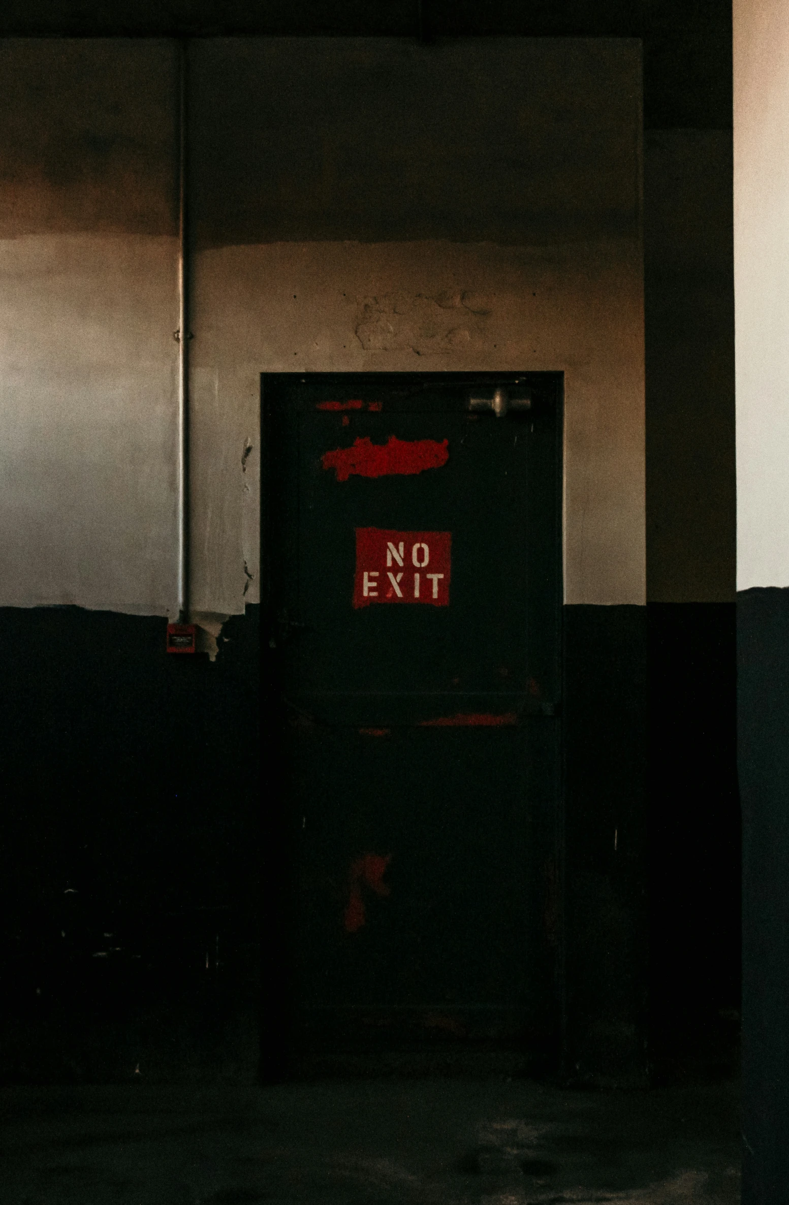 a no exit sign sitting in the middle of a room