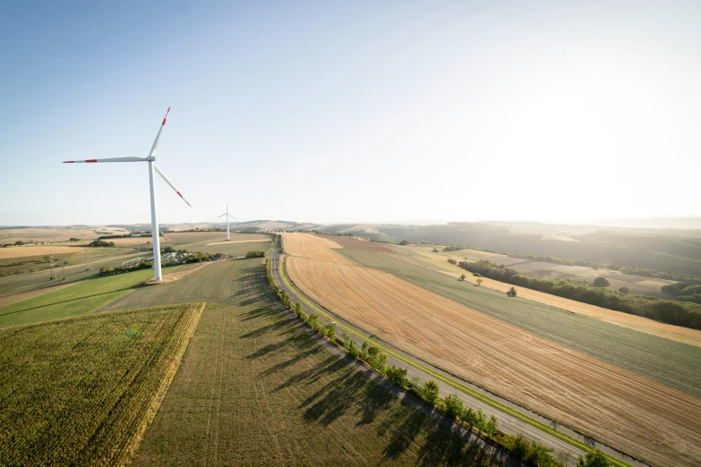 a wind turbine is shown in the middle of a field