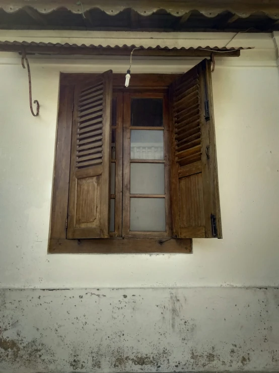 the window of the house has two shutters
