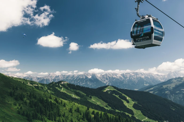 an overhead view of a chair lift going up a mountain