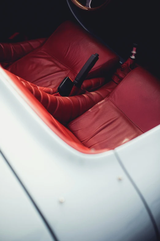 a black steering wheel sits in the center console of a car