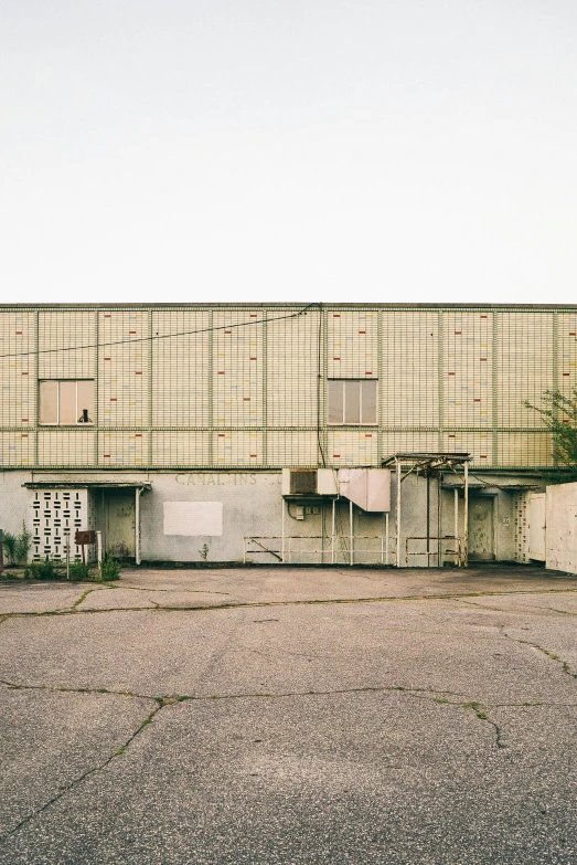 an old rundown concrete structure is pictured against a clear sky