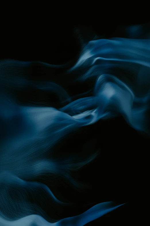 a large amount of smoke against a black background