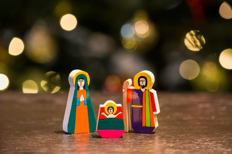 two colorful figurines are on the table