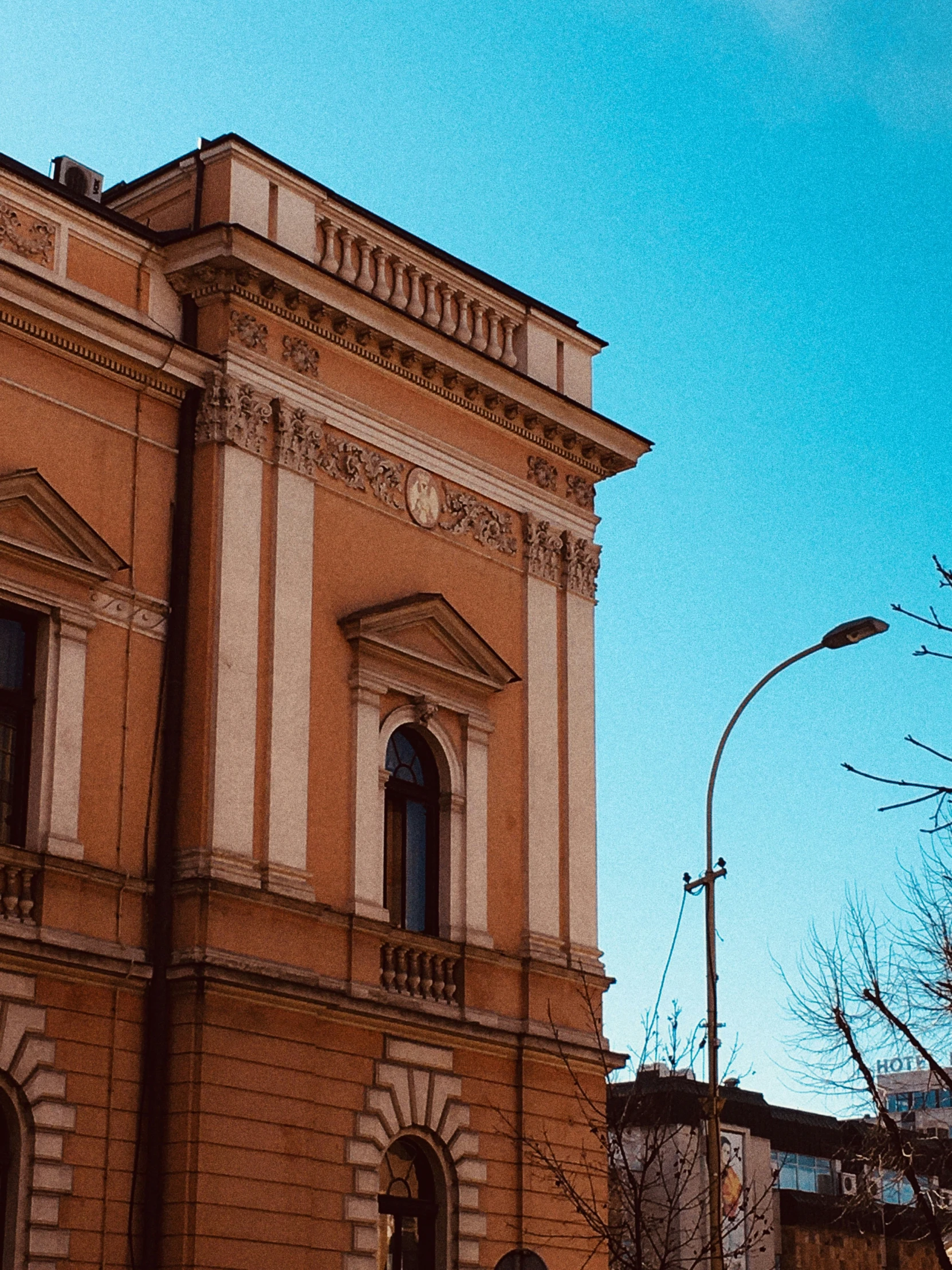 an older building in a city with a clock tower