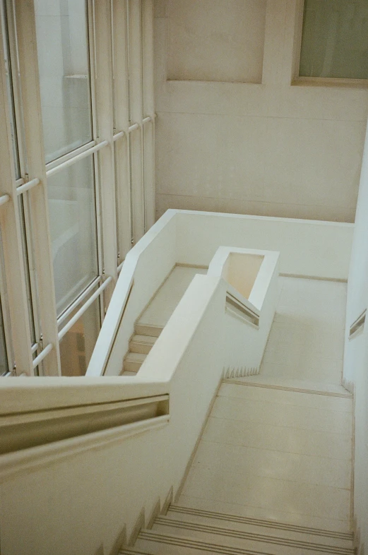 the corner room in a house with windows and a floor