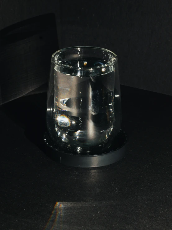 a candle holder with an object inside it