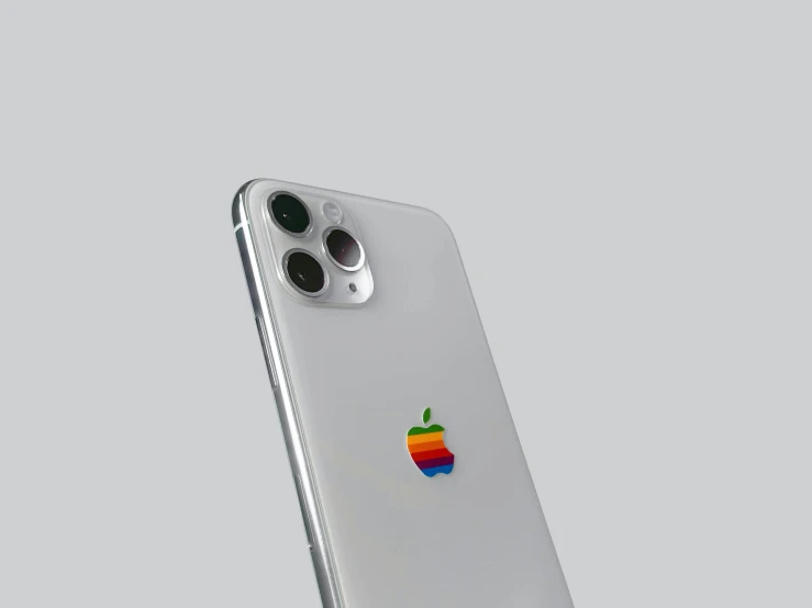 an iphone in a silver case against a gray background