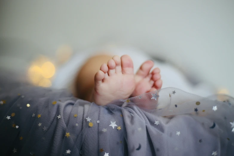 the feet and feet of a baby who is wearing a diaper