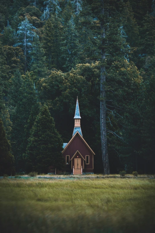 the small church has a steeple with a white roof