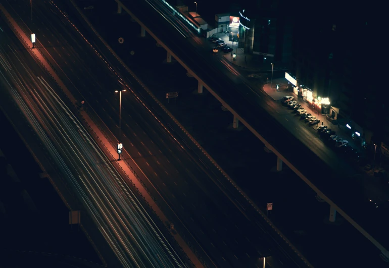 a long road at night in the middle of town