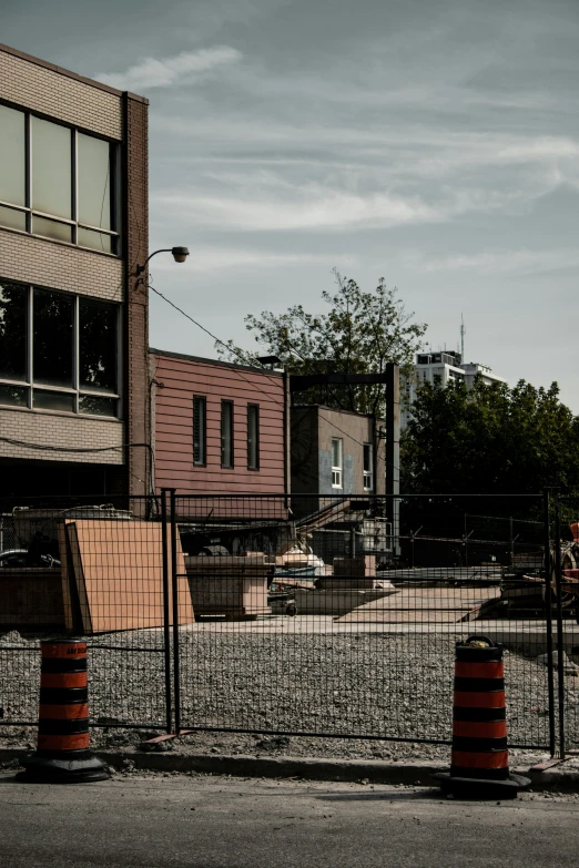 a construction area with street barricades and buildings