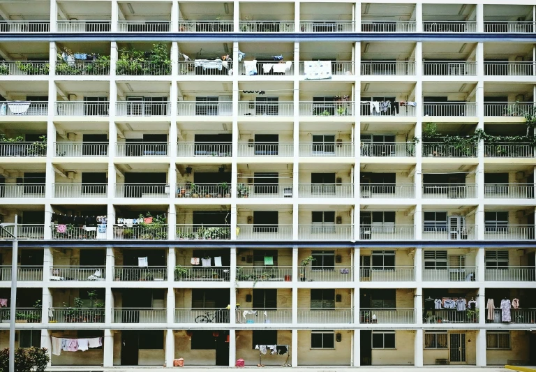 several balconies are set into a building in a courtyard