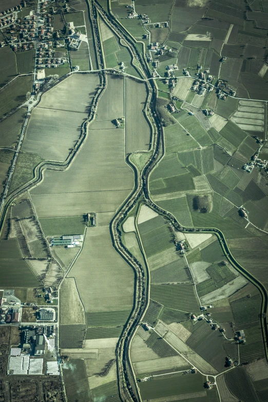 an aerial po of a winding dirt road