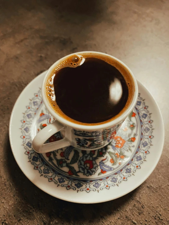 a coffee cup with an interesting saucer