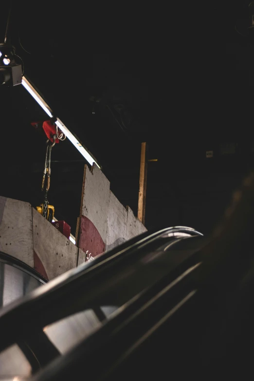 a skate boarder is riding on an escalator