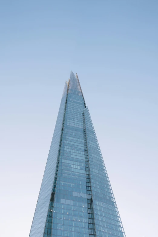 the top of the shard tower rises up into the sky