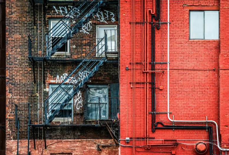 a brick building with a stairwell and a fire escape on the side