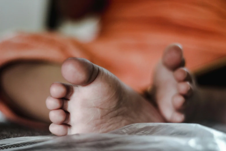 the feet of a persons feet are visible from the side
