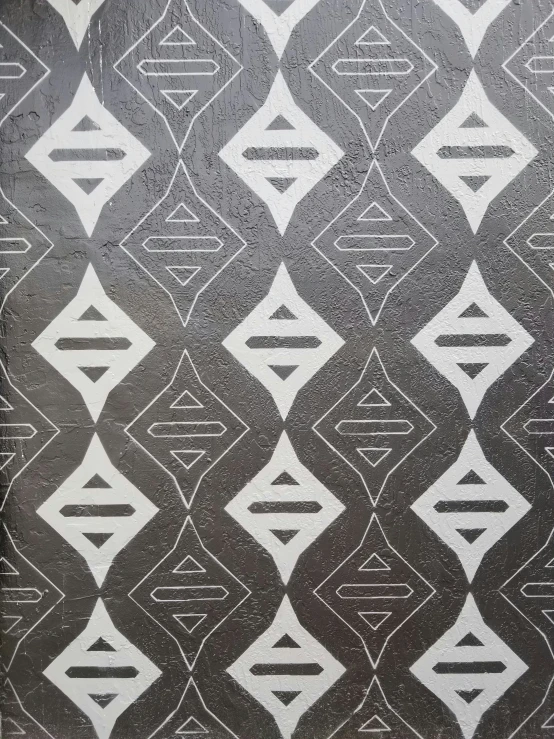 abstract black and white print of an intersecting line pattern