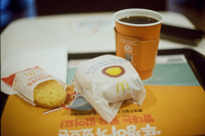 a food item is pictured next to a drink