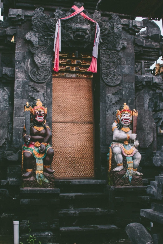 a doorway with sculptures on the outside of it