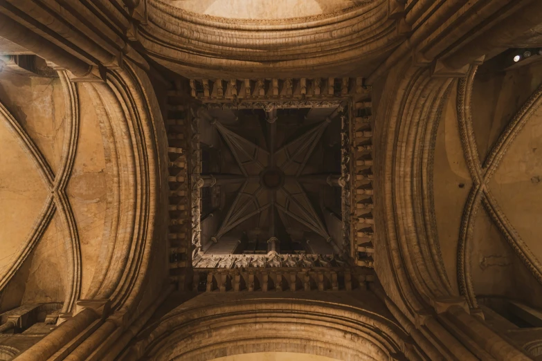 the ceiling is decorated with old carvings and mirrors