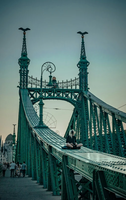 a tall bridge that is over some water