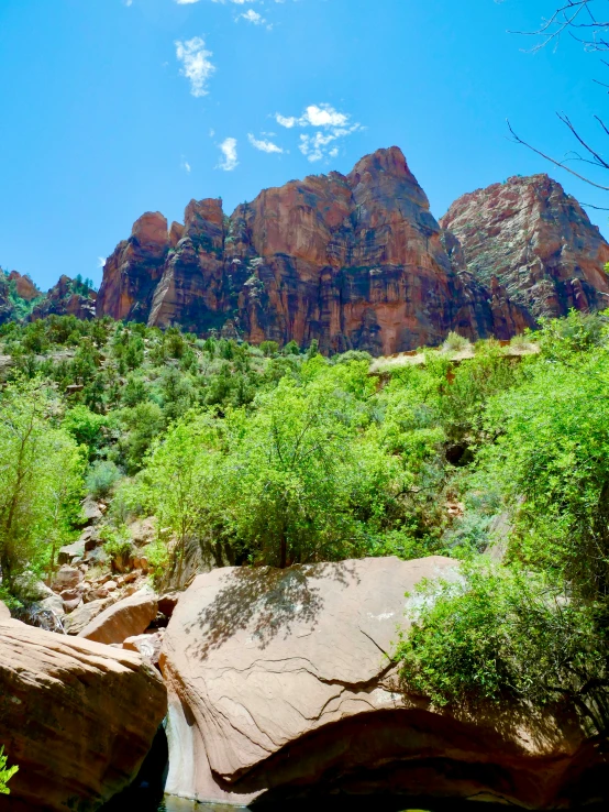 the mountain is shown with large rocks in front of it