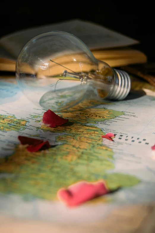 a light bulb sitting on top of a map