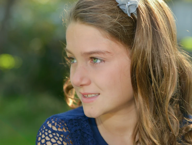 a  wearing a headband and looking straight ahead