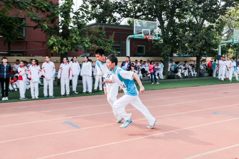 two male tennis players on the court in front of spectators