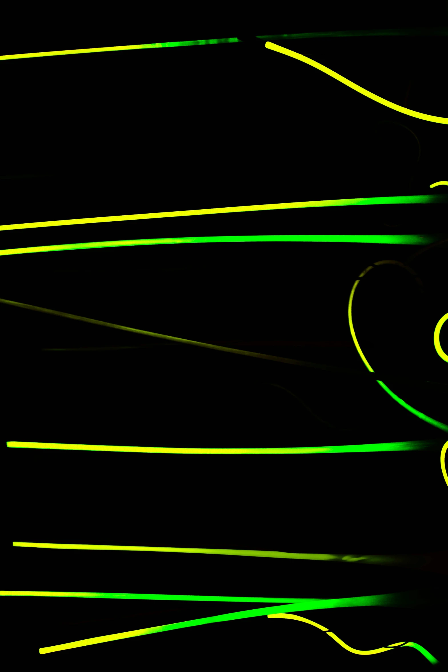 a black background with yellow and green lines