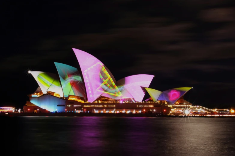 the brightly lit sydney opera at night