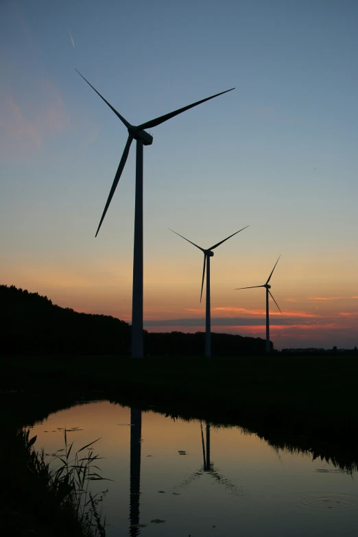 some very pretty windmills on a very pretty hill