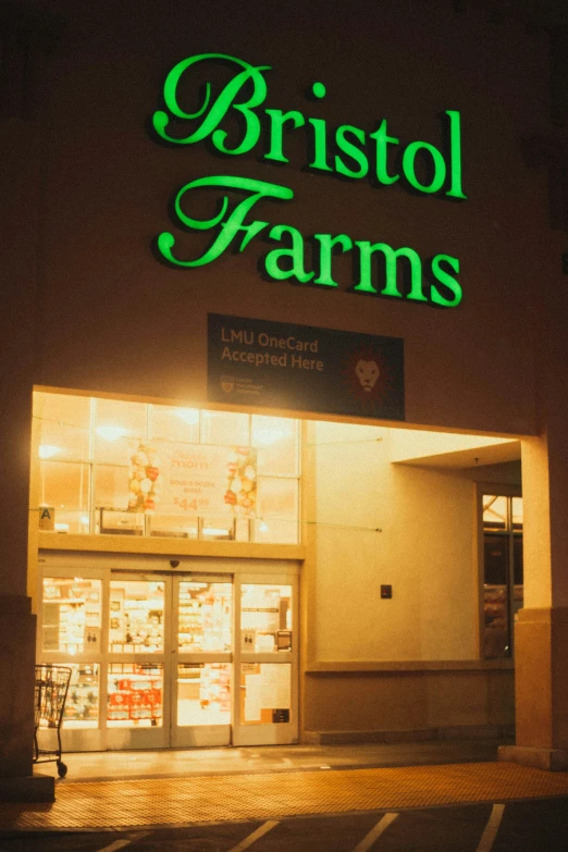 the front entrance of a farm store at night