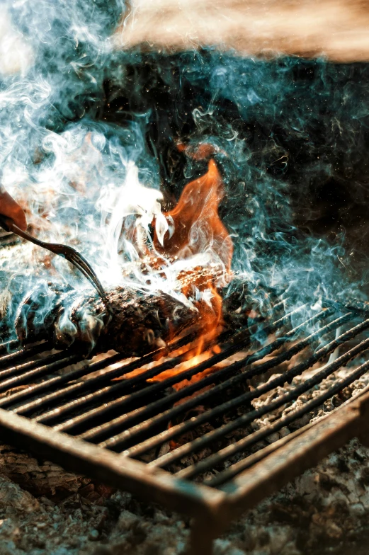 a grill with some food cooking on it