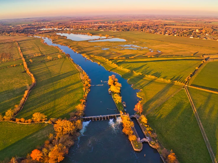 a river running through a green countryside